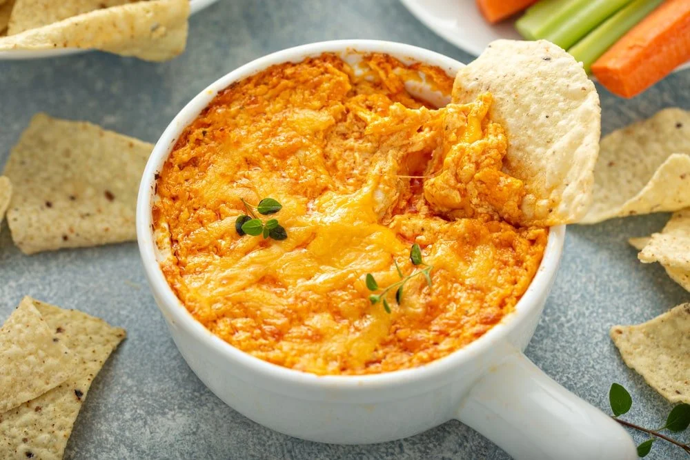 Delicious Buffalo Chicken Dip served in a bowl with tortilla chips