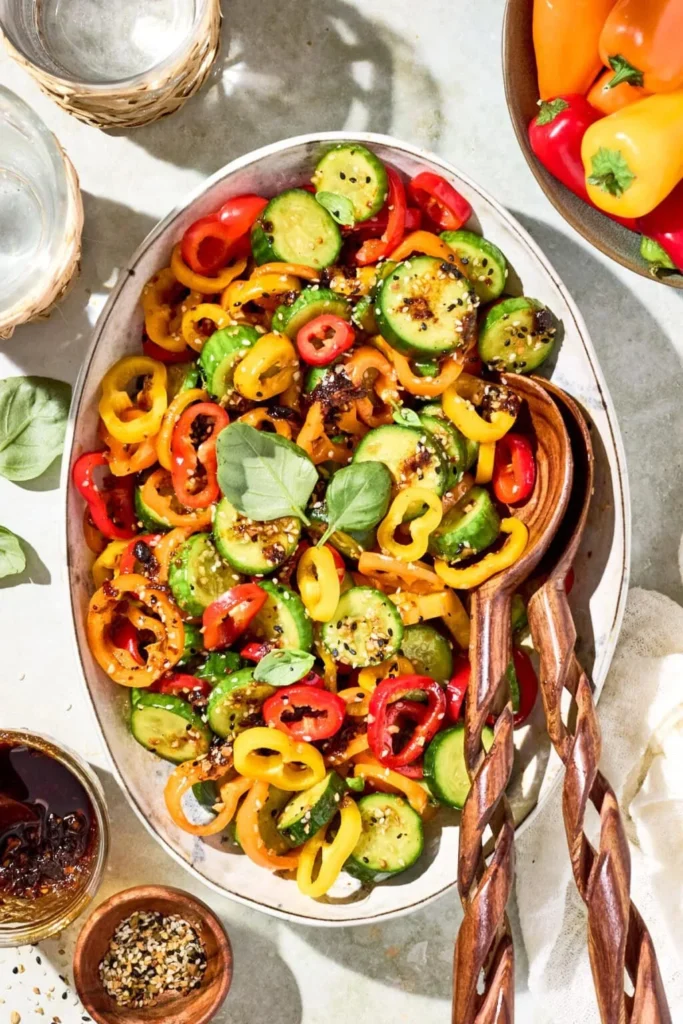 Cucumber and bell pepper salad in a beautiful bowl, fresh ingredients