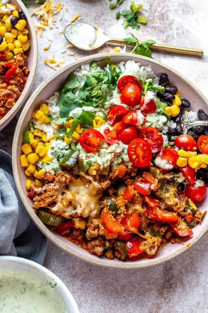 Delicious ground beef burrito bowls topped with fresh ingredients