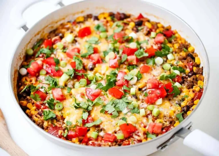 A delicious hearty burrito bowl filled with rice, beans, and colorful toppings.