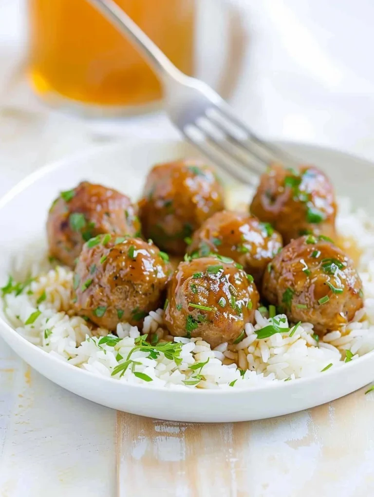 Honey Garlic Turkey Meatballs served on a plate with a garnish