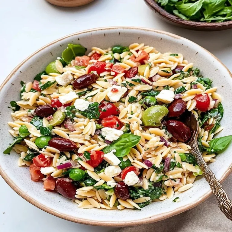 A vibrant Mediterranean Orzo Salad with colorful vegetables and herbs.
