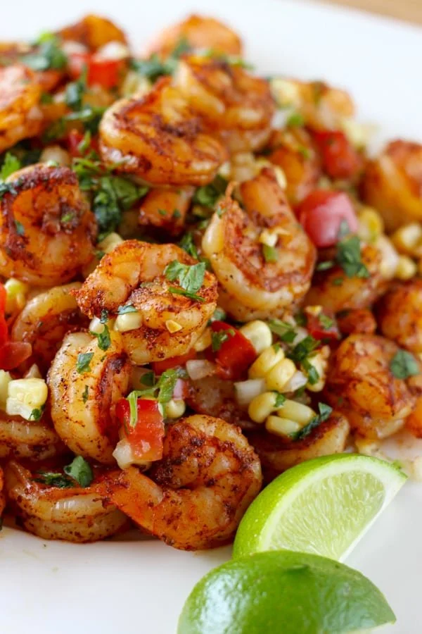 Delicious Mexican grilled shrimp served with fresh corn salsa