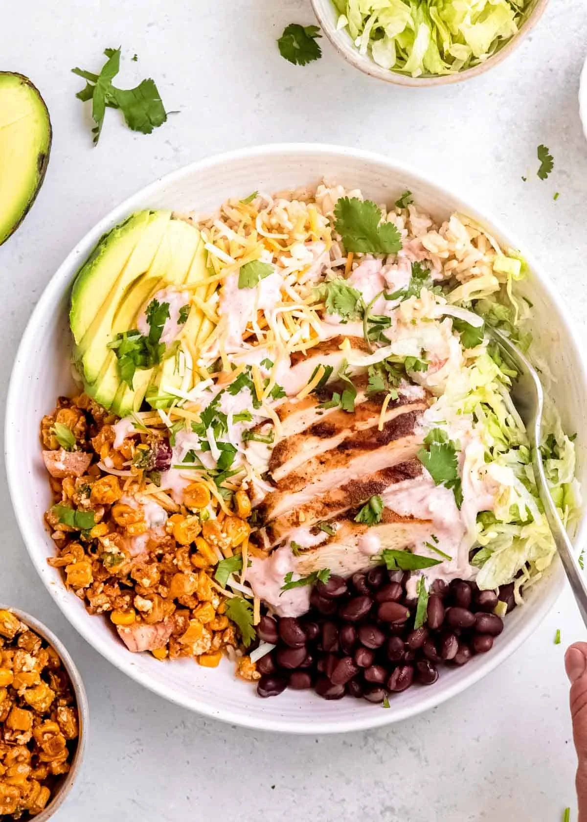 Colorful Mexican Street Corn Taco Bowls topped with fresh ingredients