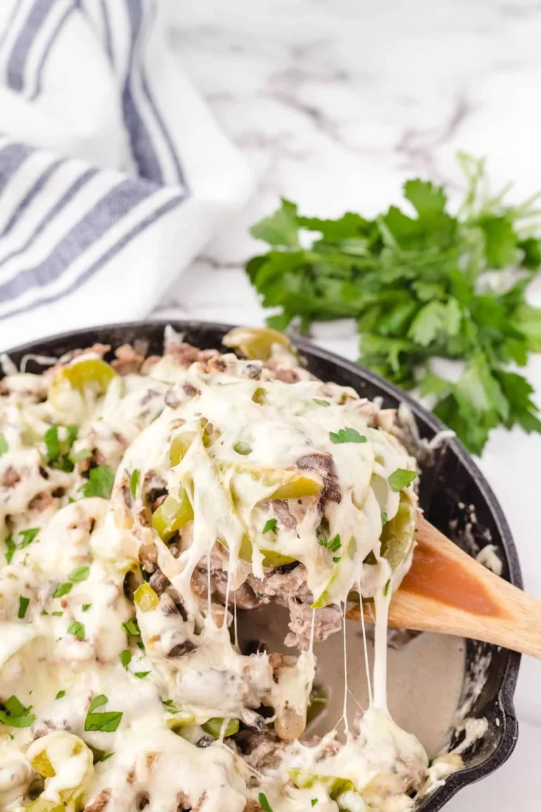 Delicious Philly Cheesesteak Casserole topped with melted cheese and peppers.