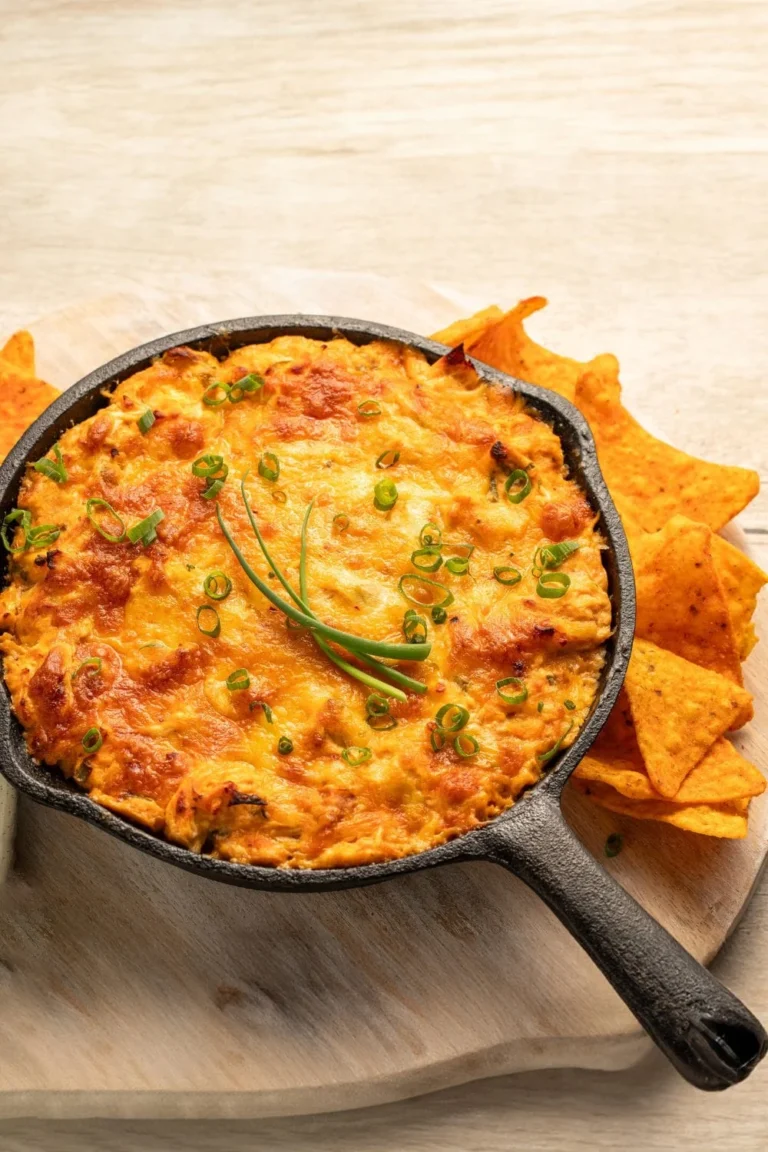 Delicious Traeger Buffalo Chicken Dip served in a bowl with tortilla chips.