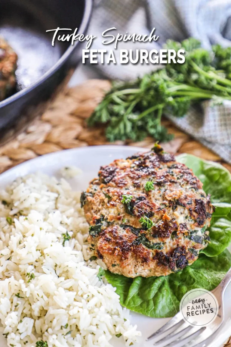 Turkey Spinach Feta Burgers on a plate with fresh ingredients