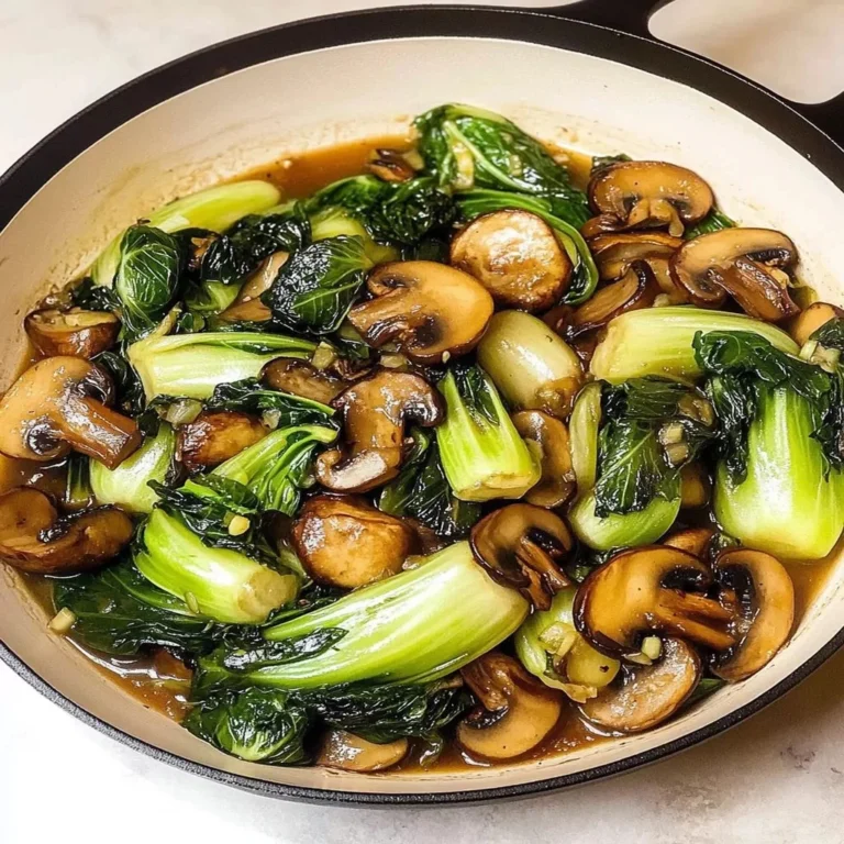 Bok choy and mushroom stir fry with colorful vegetables served in a bowl.