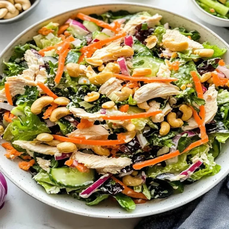 A colorful Chicken Cashew Crunch Salad with grilled chicken, cashews, and fresh vegetables