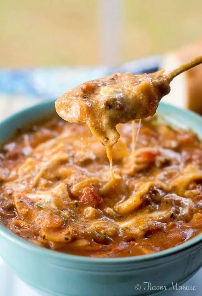 Delicious bowl of easy lasagna soup topped with cheese and herbs