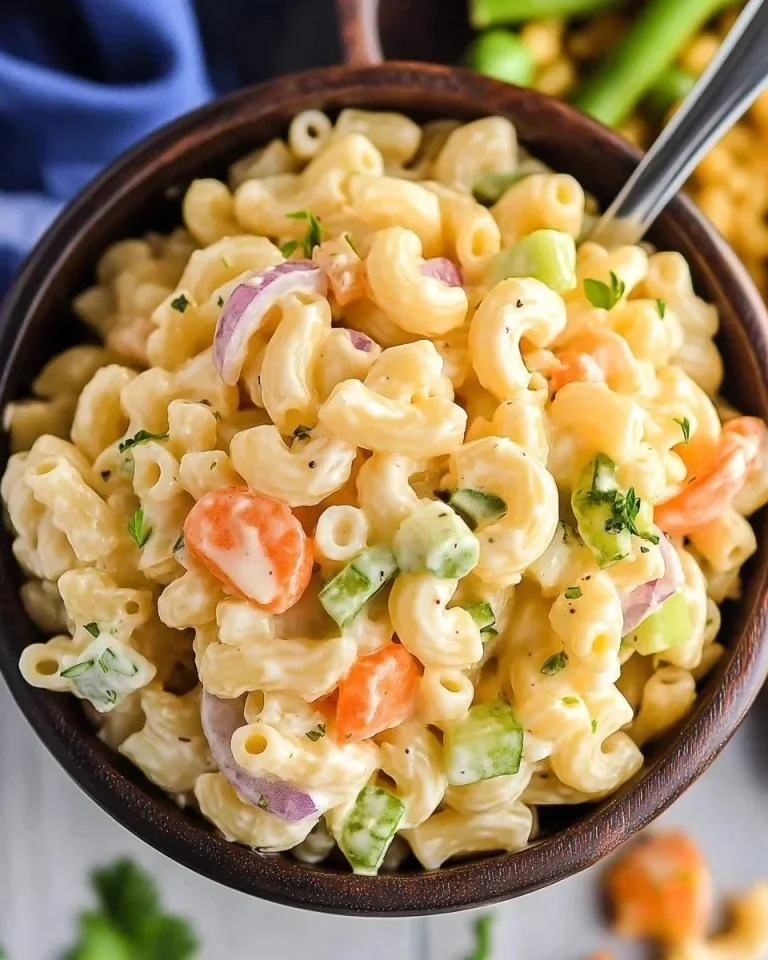 Delicious easy macaroni salad served in a bowl with vegetables
