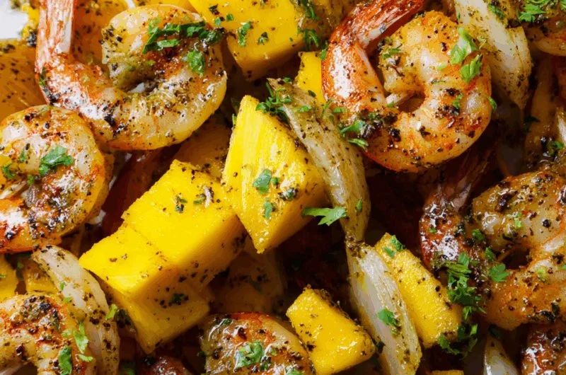 Garlic Mango Shrimp Skewers ready for grilling with vibrant ingredients.