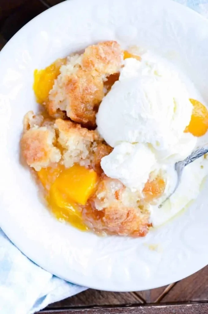 Quick and easy peach cobbler dessert fresh out of the oven