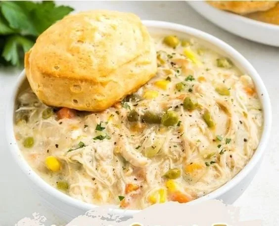 Delicious slow cooker chicken pot pie served in a rustic bowl