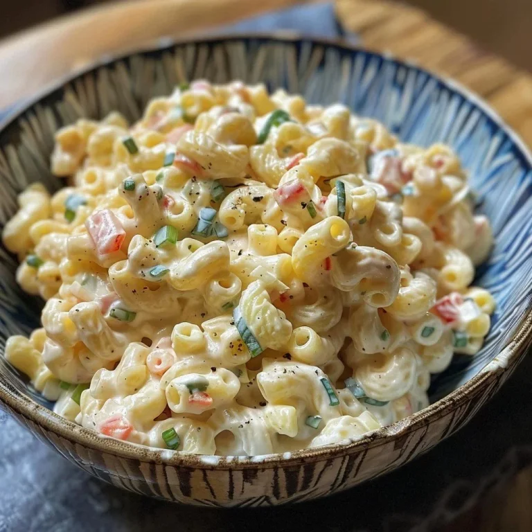 Delicious sweet macaroni salad with colorful ingredients in a bowl