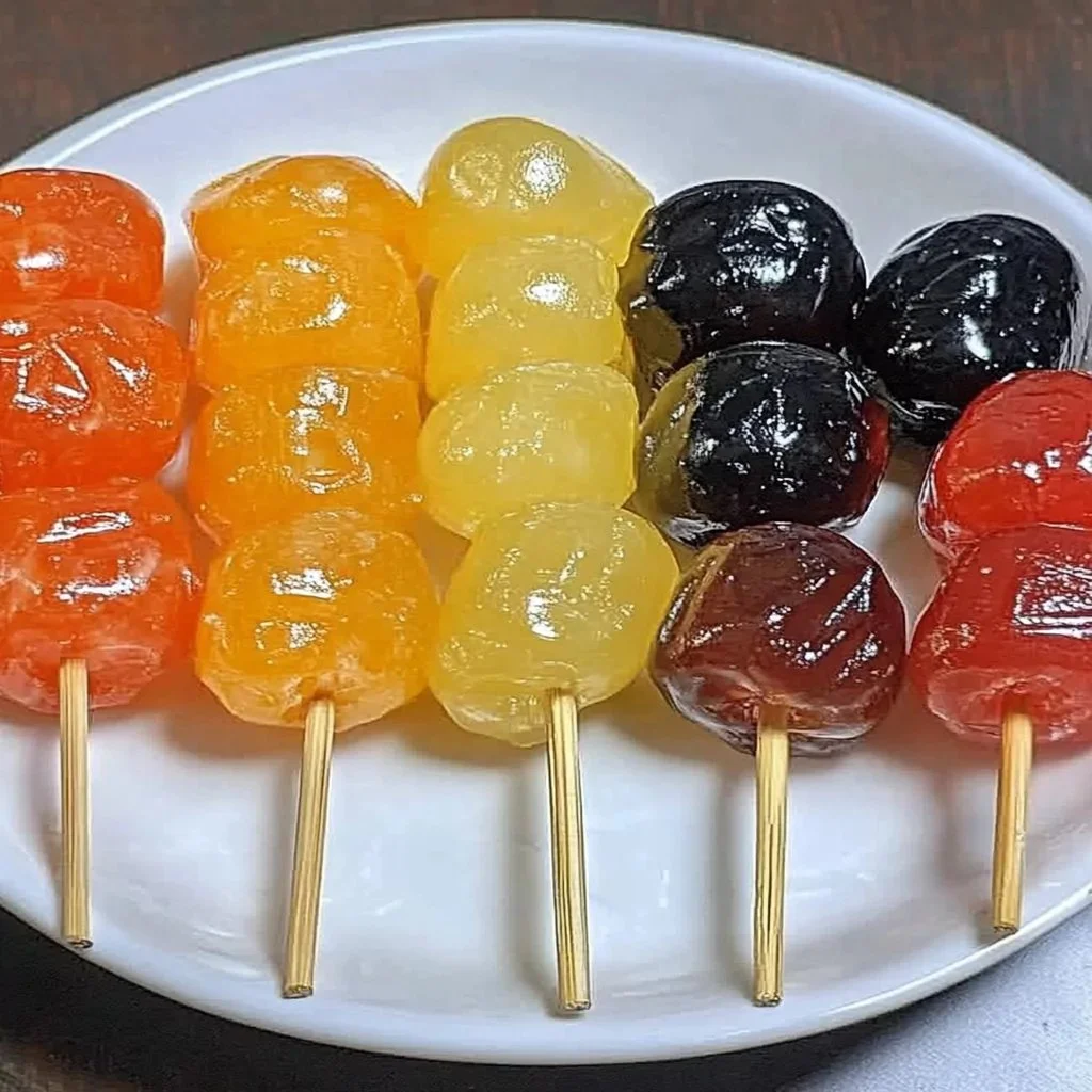 Tanghulu - Traditional Chinese candied fruit on skewers, showcasing vibrant colors and delicious glaze.